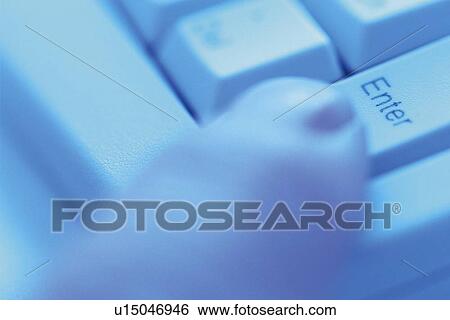 Stock Photograph - Finger and keyboard, Pin Focus. Fotosearch