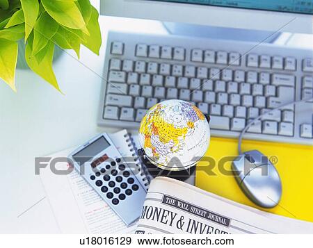 Stock Photo - Globe and desktop Computer, High Angle View. Fotosearch
