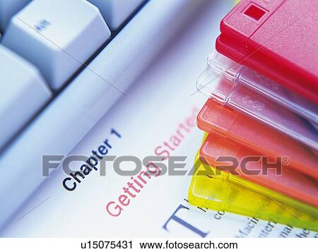 Stock Image - Keyboard and Colorful discs, Close Up, High Angle View. Fotosearch