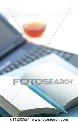 Laptop computer and a notebook, Pin Focus, High Angle View View Large Photo Image Picture - Laptop computer and a notebook, Pin Focus, High Angle View. Fotosearch