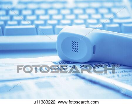 Stock Image - Lying handset, Pin Focus, Toned Image. Fotosearch