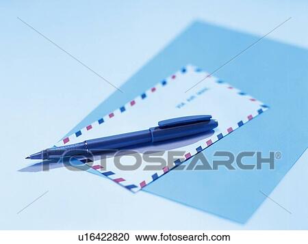 Stock Image - Pen, envelope and notepaper, High Angle View, Toned Image, Pin Focus. Fotosearch