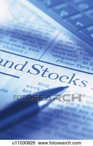 Stock Photograph - Pen, news paper and calculator, Pin Focus, Close Up. Fotosearch