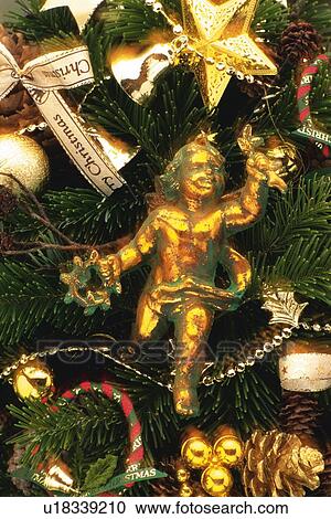 Angel and Christmas ornaments on Christmas tree, front view, close up View Large Photo Image Stock Image - Angel and Christmas ornaments on Christmas tree, front view, close up. Fotosearch