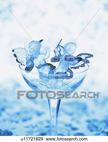 Angels in glass playing violin, high angle view, close up View Large Photo Image Stock Photo - Angels in glass playing violin, high angle view, close up. Fotosearch