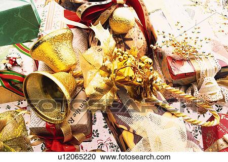 Stock Image - Christmas ornaments and presents, high angle view. Fotosearch