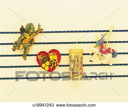 Christmas ornaments on blue lines, white background, high angle view View Large Photo Image Stock Image - Christmas ornaments on blue lines, white background, high angle view. Fotosearch
