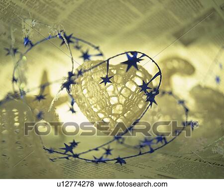 Christmas ornaments on newspaper, close up View Large Photo Image Stock Photo - Christmas ornaments on newspaper, close up. Fotosearch