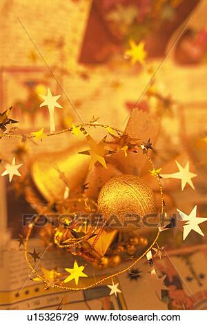 Christmas ornaments on paper, high angle view, close up View Large Photo Image Stock Photo - Christmas ornaments on paper, high angle view, close up. Fotosearch