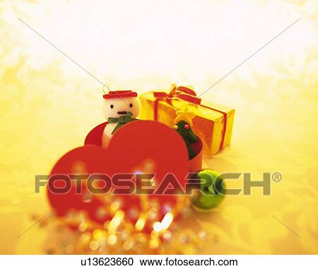 Christmas ornaments, snowman and Christmas tree in heart shaped box, front view View Large Photo Image Stock Image - Christmas ornaments, snowman and Christmas tree in heart shaped box, front view. Fotosearch