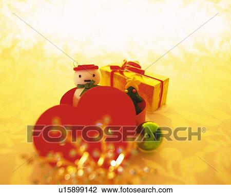 Christmas ornaments, snowman and Christmas tree in heart shaped box, front view View Large Photo Image Stock Image - Christmas ornaments, snowman and Christmas tree in heart shaped box, front view. Fotosearch