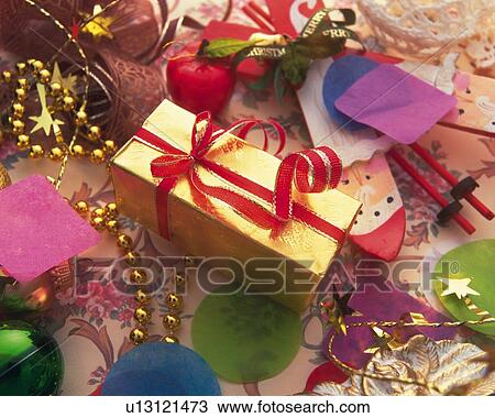 Christmas present among Christmas ornaments, high angle view View Large Photo Image Stock Image - Christmas present among Christmas ornaments, high angle view. Fotosearch