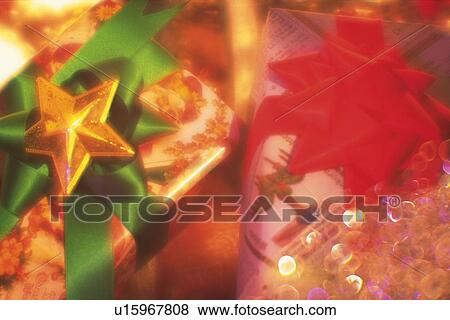 Stock Photo - Christmas presents, high angle view, close up, soft focus. Fotosearch
