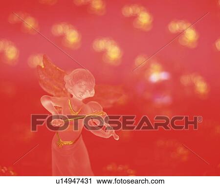 Glass angel playing violin, front view, red background View Large Photo Image Stock Image - Glass angel playing violin, front view, red background. Fotosearch