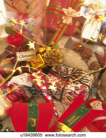 Stock Photography - Pile of Christmas ornaments and presents, high angle view, close up. Fotosearch