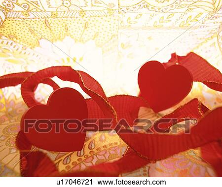 Red ribbons and heart shaped ornaments, close up View Large Photo Image Stock Image - Red ribbons and heart shaped ornaments, close up. Fotosearch