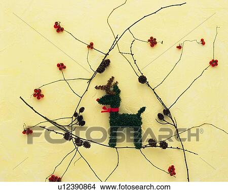 Reindeer ornament on twigs View Large Photo Image Picture - Reindeer ornament on twigs. Fotosearch