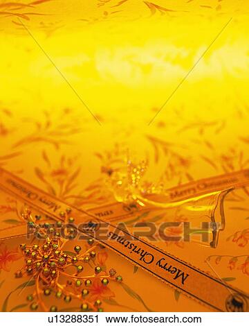 Stock Image - Ribbons printed "Merry Christmas", high angle view, toned image. Fotosearch