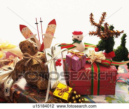 Teddy bear and presents with Christmas ornaments, high angle view View Large Photo Image Stock Image - Teddy bear and presents with Christmas ornaments, high angle view. Fotosearch