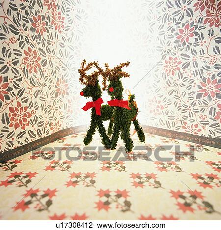 Two reindeer ornaments standing side by side, front view, composition View Large Photo Image Stock Image - Two reindeer ornaments standing side by side, front view, composition. Fotosearch