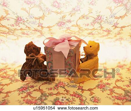 teddy bear holding a box