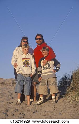 A family enjoying their vacation at the beach View Large Photo Image Stock Photo - A family enjoying their vacation at the beach. Fotosearch