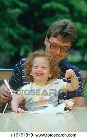 A father and daughter eating ice cream View Large Photo Image Stock Photo - A father and daughter eating ice cream. Fotosearch