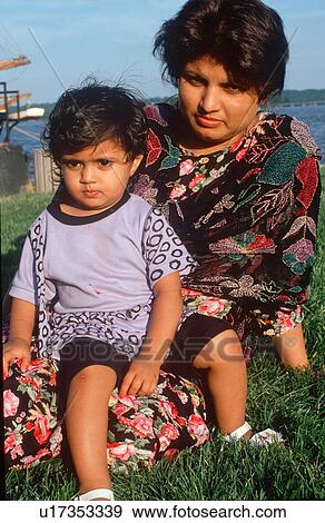 Stock Photo - A Pakistani mother and child at a harbor. Fotosearch