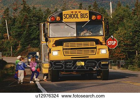 Children boarding a yellow school bus View Large Photo Image Picture - Children boarding a yellow school bus. Fotosearch