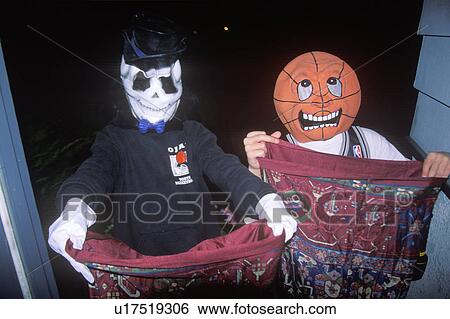 Children trick or treating on Halloween View Large Photo Image Stock Photograph - Children trick or treating on Halloween. Fotosearch