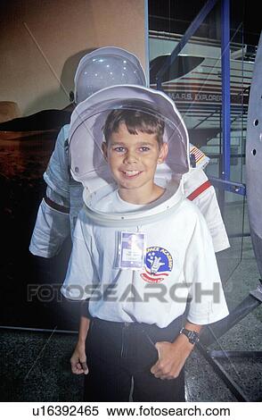 Stock Photography - Children try on $1 million spacesuit at Space Camp. Fotosearch