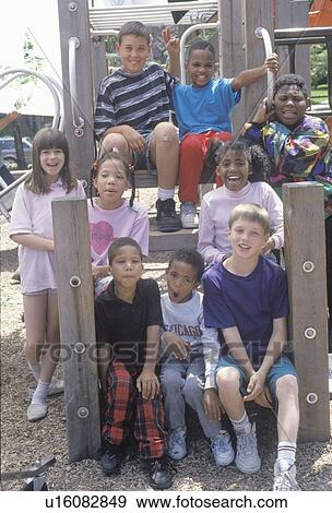 Stock Photo - Ethnically diverse group of children in a city park. Fotosearch