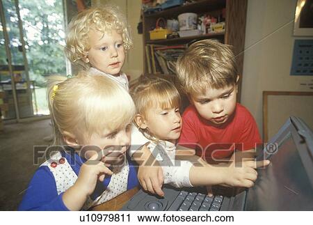Pre-schoolers exploring a laptop computer View Large Photo Image Stock Image - Pre-schoolers exploring a laptop computer. Fotosearch