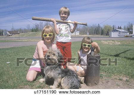 Three children with their dog View Large Photo Image Stock Image - Three children with their dog . Fotosearch