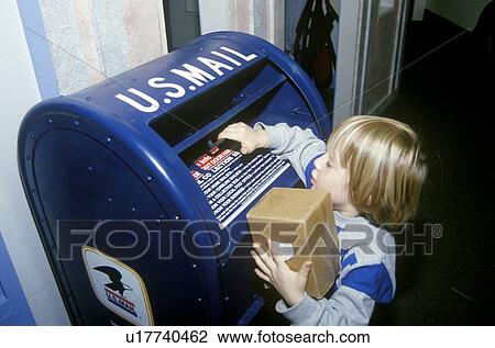 Youngster depositing package into mailbox View Large Photo Image Stock Image - Youngster depositing package into mailbox. Fotosearch