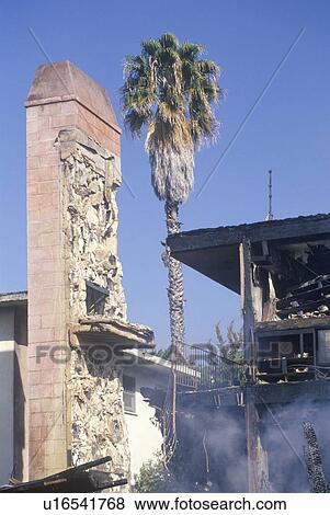 An apartment building on fire as a result of an earthquake View Large Photo Image Stock Photo - An apartment building on fire as a result of an earthquake. Fotosearch