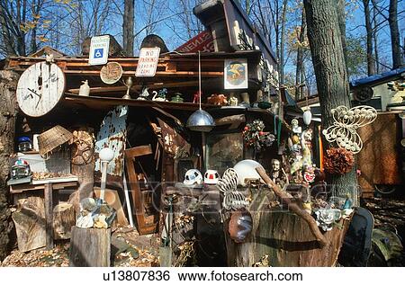 Collectibles and junk in a back yard View Large Photo Image Stock Photograph - Collectibles and junk in a back yard. Fotosearch