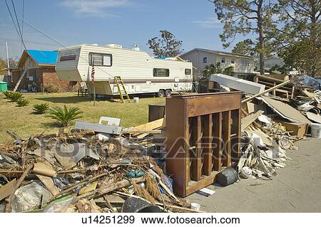 Debris and old piano in front of house heavily hit by Hurricane Ivan View Large Photo Image Stock Photo - Debris and old piano in front of house heavily hit by Hurricane Ivan. Fotosearch