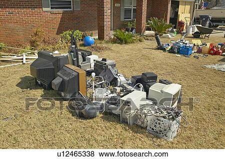 Stock Photo - Debris in front of house heavily hit by Hurricane Ivan . Fotosearch