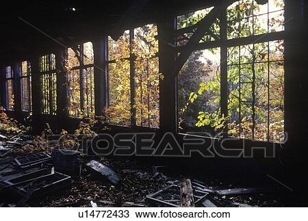 Deserted factory with broken windows and debris View Large Photo Image Stock Image - Deserted factory with broken windows and debris. Fotosearch