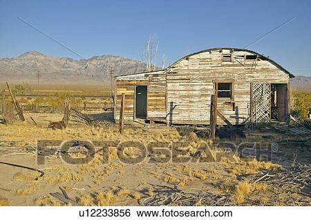 Stock Photograph - Falling down old mining buildings in mining area . Fotosearch