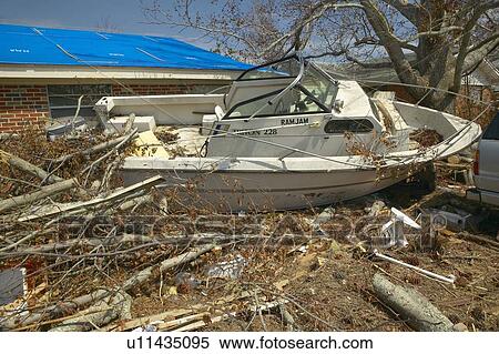 Ram Jam boat and debris in front of house heavily hit by Hurricane Ivan View Large Photo Image Stock Photography - Ram Jam boat and debris in front of house heavily hit by Hurricane Ivan. Fotosearch