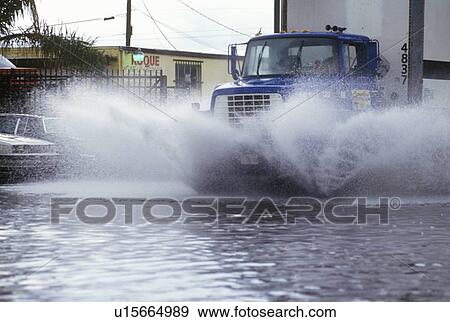 Truck Driving Through Flooded Street View Large Photo Image Stock Photo - Truck Driving Through Flooded Street. Fotosearch