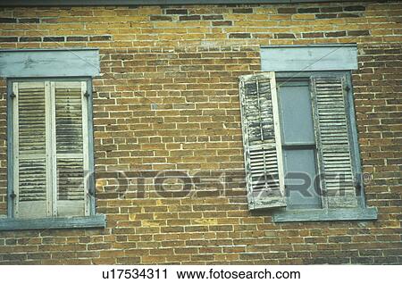 Window shutters on an abandoned brick hotel View Large Photo Image Stock Image - Window shutters on an abandoned brick hotel. Fotosearch