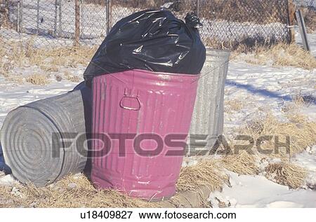 A full pink trash can waiting for pickup View Large Photo Image Stock Photo - A full pink trash can waiting for pickup. Fotosearch