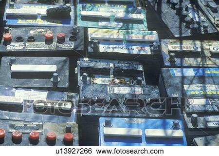 Stock Photograph - A pile of car batteries ready for disposal. Fotosearch