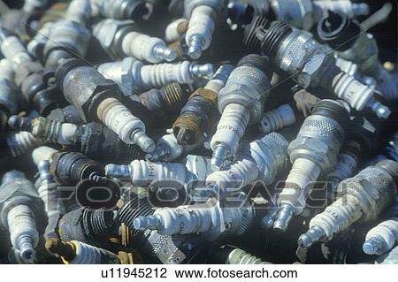 Stock Image - A pile of used spark plugs ready for recycling. Fotosearch