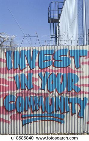 Stock Image - A sign that reads “Invest in Your Community”. Fotosearch