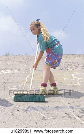 A young girl cleaning up with a push broom View Large Photo Image Stock Image - A young girl cleaning up with a push broom. Fotosearch