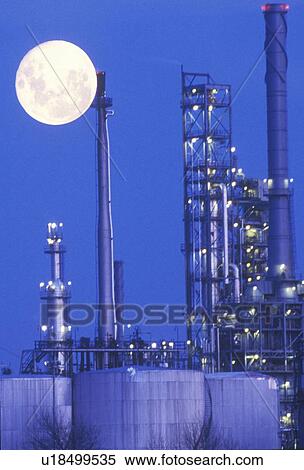 Stock Photography - An industrial moonrise over a chemical plant, USA. Fotosearch